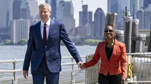 FILE - New York City Mayor Bill de Blasio and his wife Chirlane McCray arrive for the official dedication ceremony of the Statue of Liberty Museum on Liberty Island, May 16, 2019, in New York. Former New York CIty Mayor de Blasio and McCray are separating but not divorcing after 29 years of a marriage that helped lift de Blasio into the mayor's job. (AP Photo/Craig Ruttle, File)