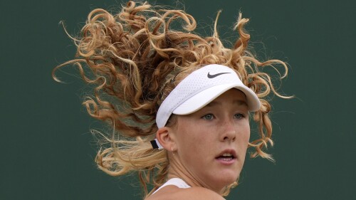 Russia's Mirra Andreeva plays a return to Russia's Anastasia Potapova during the women's singles match on day seven of the Wimbledon tennis championships in London, Sunday, July 9, 2023. (AP Photo/Alberto Pezzali)