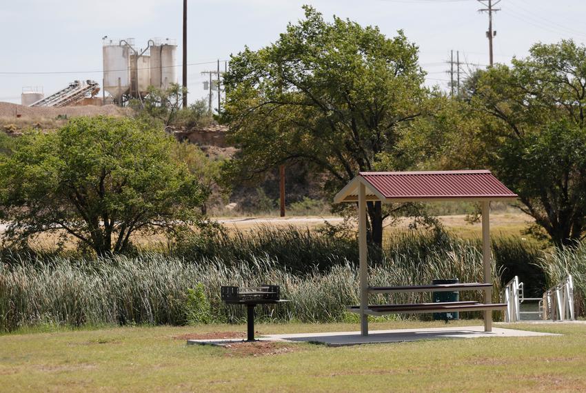 The Triple C Concrete Plant can be seen from a picnic area in Lubbock on Wednesday, July 26, 2023. The North and East Lubbock Coalition filed a Title VI Civil Rights Complaint against the city citing discriminatory zoning practices. Minority neighborhoods have had to deal with problems related hoping to get the city to address their complaints.