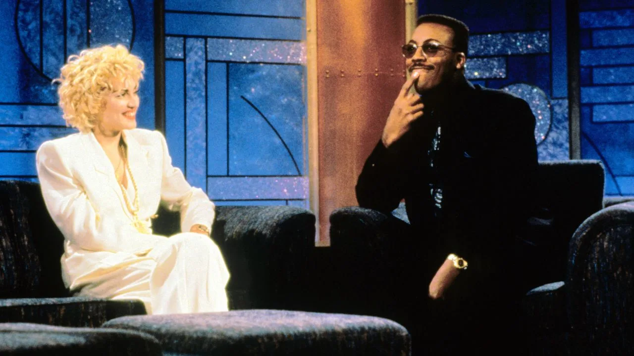 Madonna and Arsenio Hall on his late night talk show. 