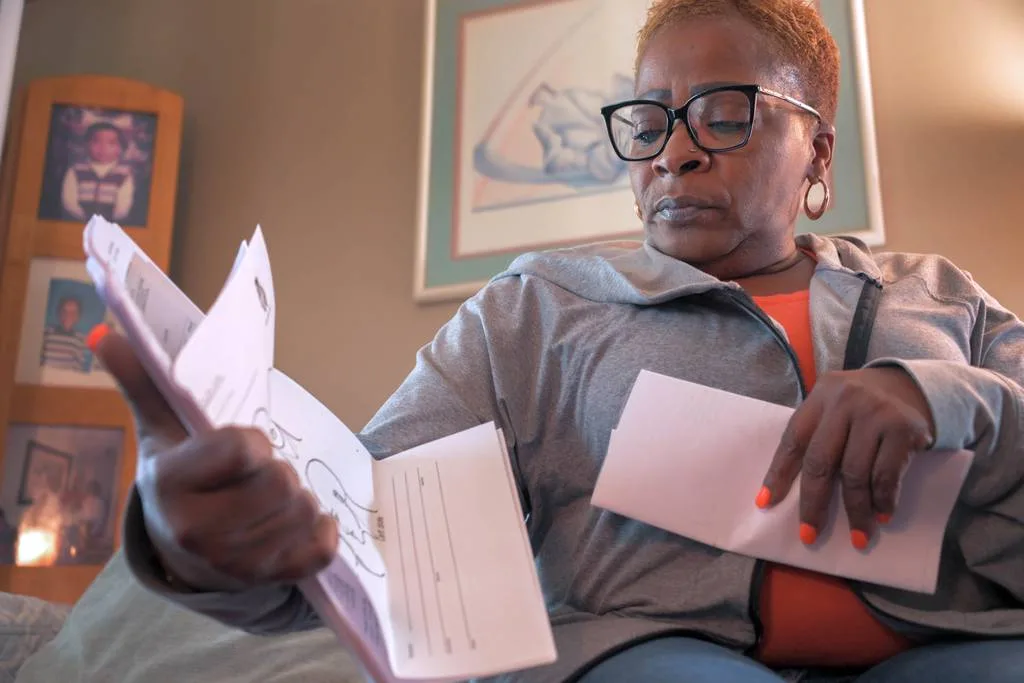 Samantha Hart – daughter of Henry Hart, who has dementia – looks at documents relating to her father's arrest at the Hart home. The family filed a complaint with Baltimore County after his health declined when he was taken to jail. As Maryland’s population ages, experts fear police will encounter people with dementia more frequently, won't recognize the condition and won't know how to respond to it.