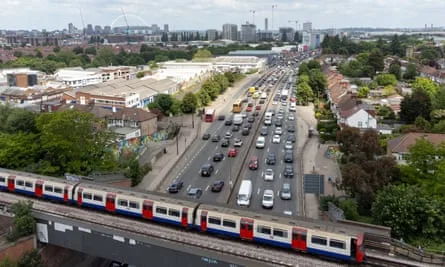 A tube train and traffic near Wembley stadium, London
