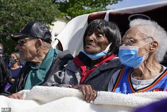 Tulsa Race Massacre survivors Hughes Van Ellis, left, his sister Viola Fletcher, right and Lessie Benningfield Randle, center are pictured in 2021