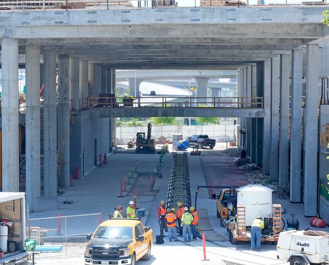 Rail line is laid in the transit concourse area for the Hop streetcar at the Couture high-rise apartment project on East Michigan Street in downtown Milwaukee on June 1.