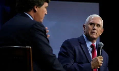 Tucker Carlson (left) and Mike Pence (right) at an event in Des Moines earlier today.