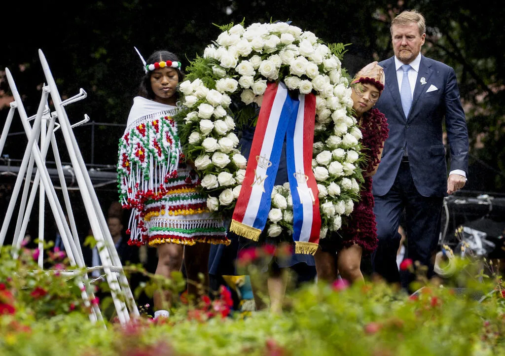 Dutch King Willem-Alexander lays a wreath at the national slavery monument in Amsterdam after apologising for the royal family's role in slavery, on 1 July 2023.