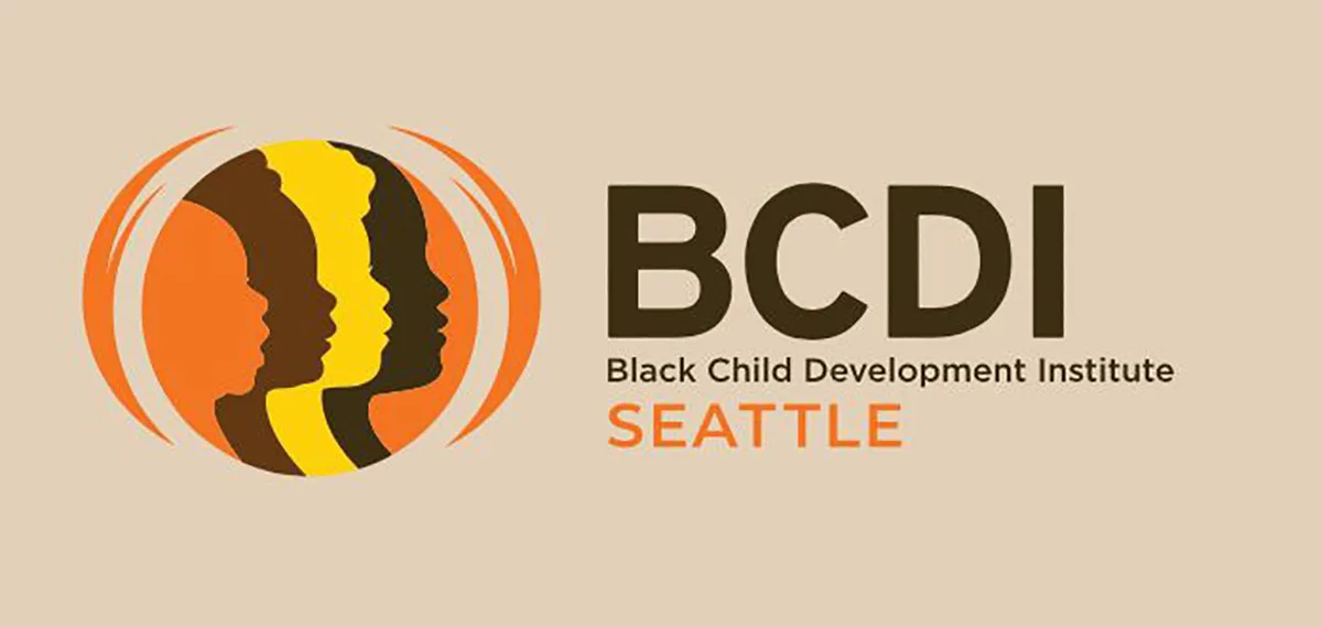 A tan background with a the profile of children's faces silhouetted in orange, brown, yellow, and black in a circle logo. Text reads 