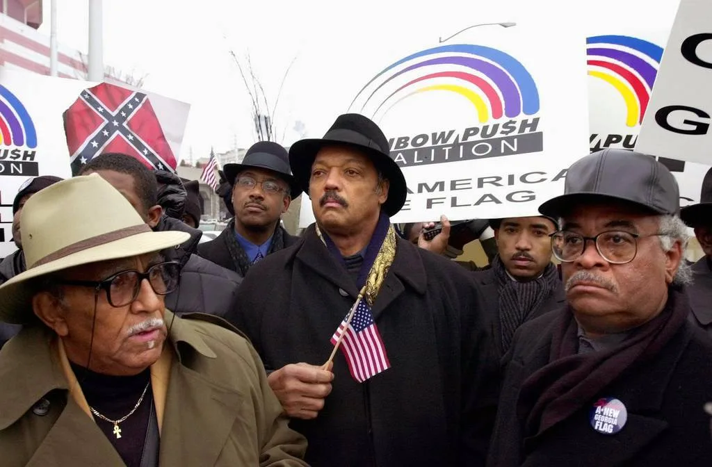 Reverend Jesse Jackson and other members of the Rainbow Coalition march in front of the Georgia Dome in Atlanta in January 2000, site of Super Bowl XXXIV.