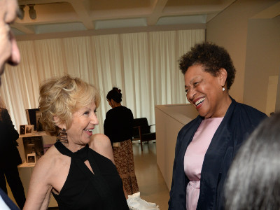 Carrie Mae Weems greeting guests at the Barbican Art Gallery in London.