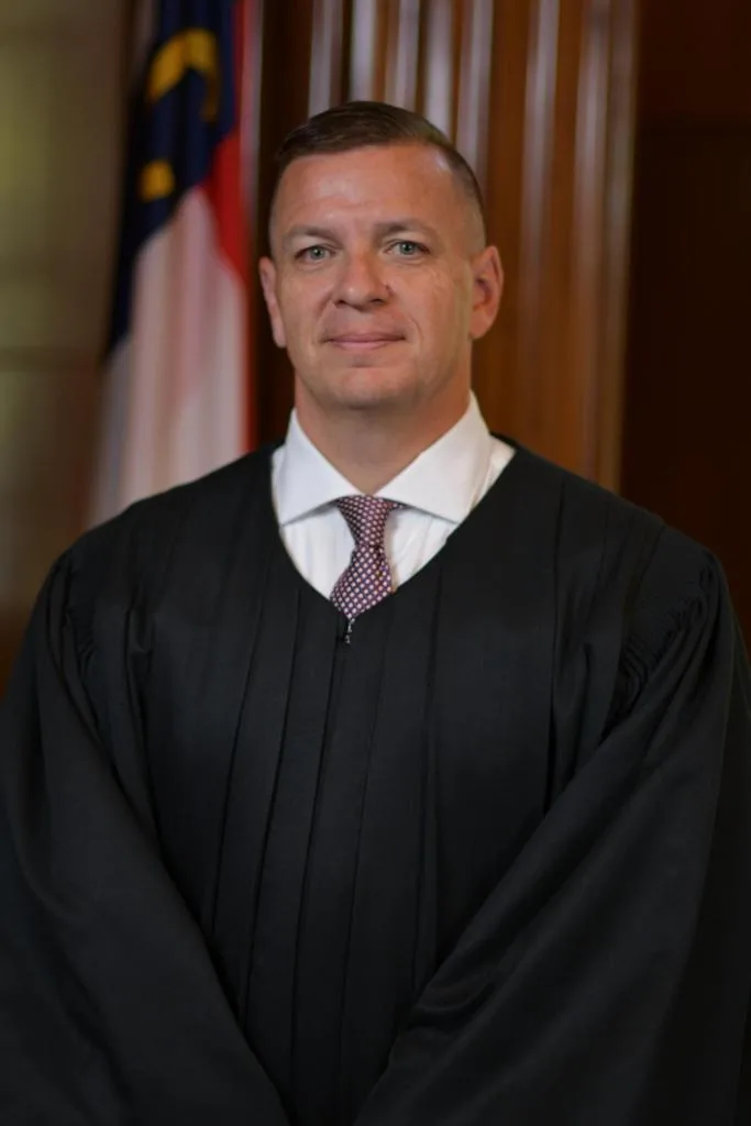 North Carolina Supreme Court Associate Justice Phillip Berger Jr. poses in his judicial robe.