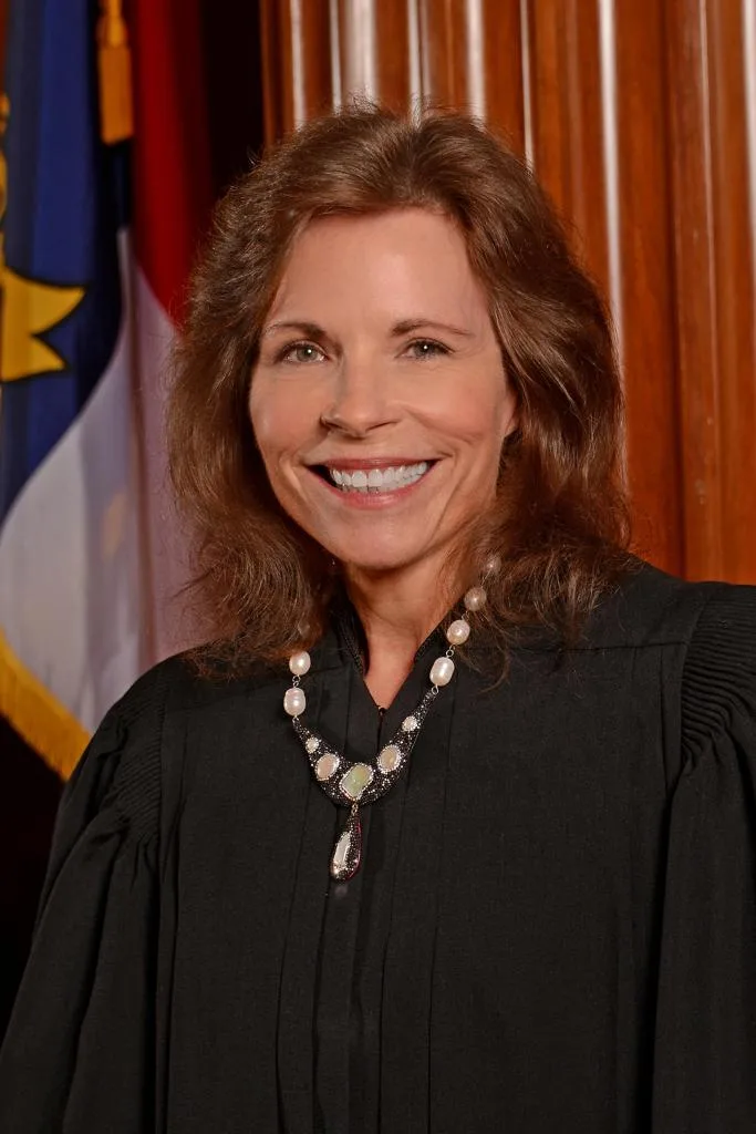 North Carolina Supreme Court Associate Justice Tamara Barringer poses in her judicial robe.