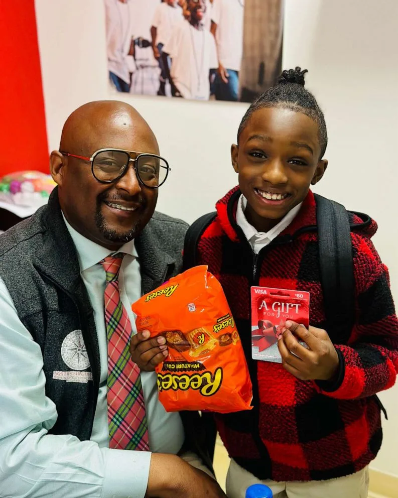 PHOTO: Calvin Jones delivers gifts to Principal Craig on National Principal's Day in 2023.
