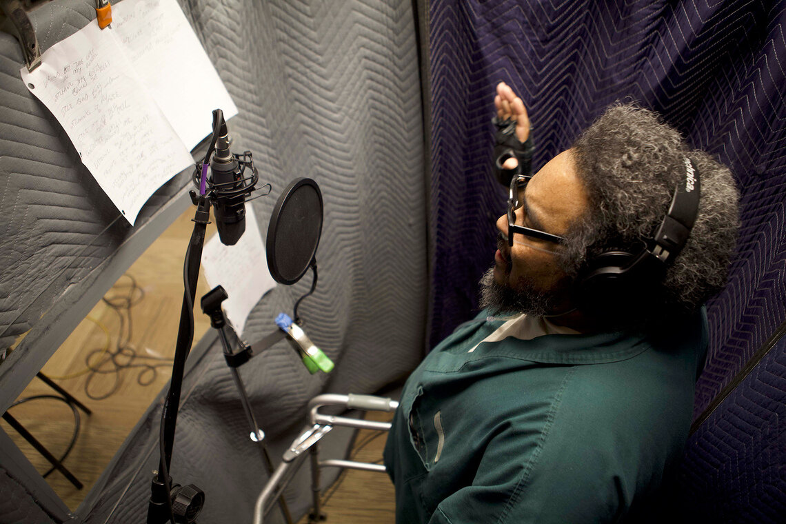 Kevin Woodley records in a soundproof studio.