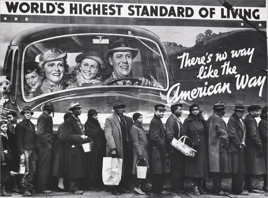 Black residents of Louisville, Kentucky, are lined up seeking assistance in the wake of a catastrophic flood, below a National Association of Manufacturers billboard that depicts a happy white family enjoying “the world’s highest standard of living.” Additional text on the billboard reads 