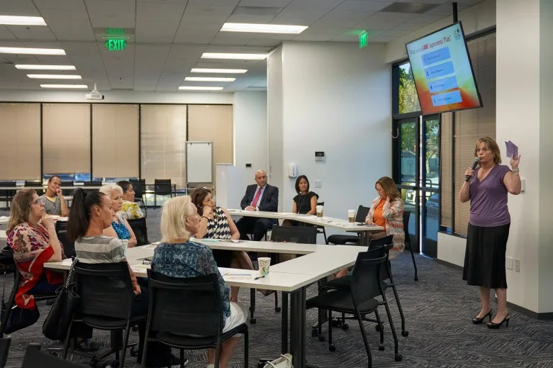 Annette Mugrditchian, deputy director, speaks to community members about CARE Court, a new program that will be implemented in October of 2023, at the Behavioral Health Training Center in Orange County on Aug. 17, 2023. Photo by Lauren Justice for CalMatters