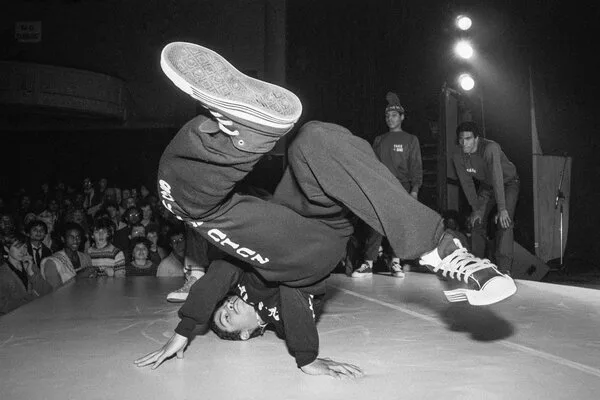 Ken Swift break dancing on stage.