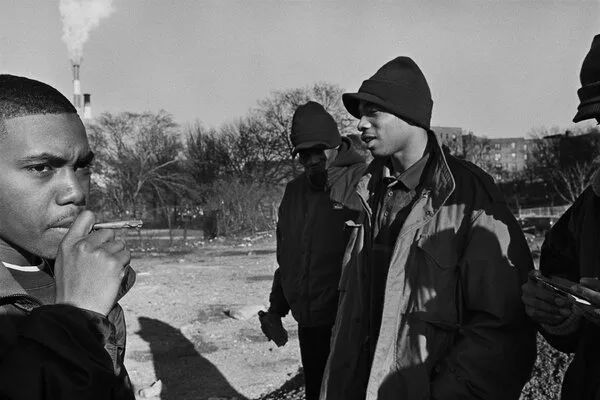 Nas with friends outside.