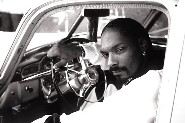 Snoop Dogg in a car.