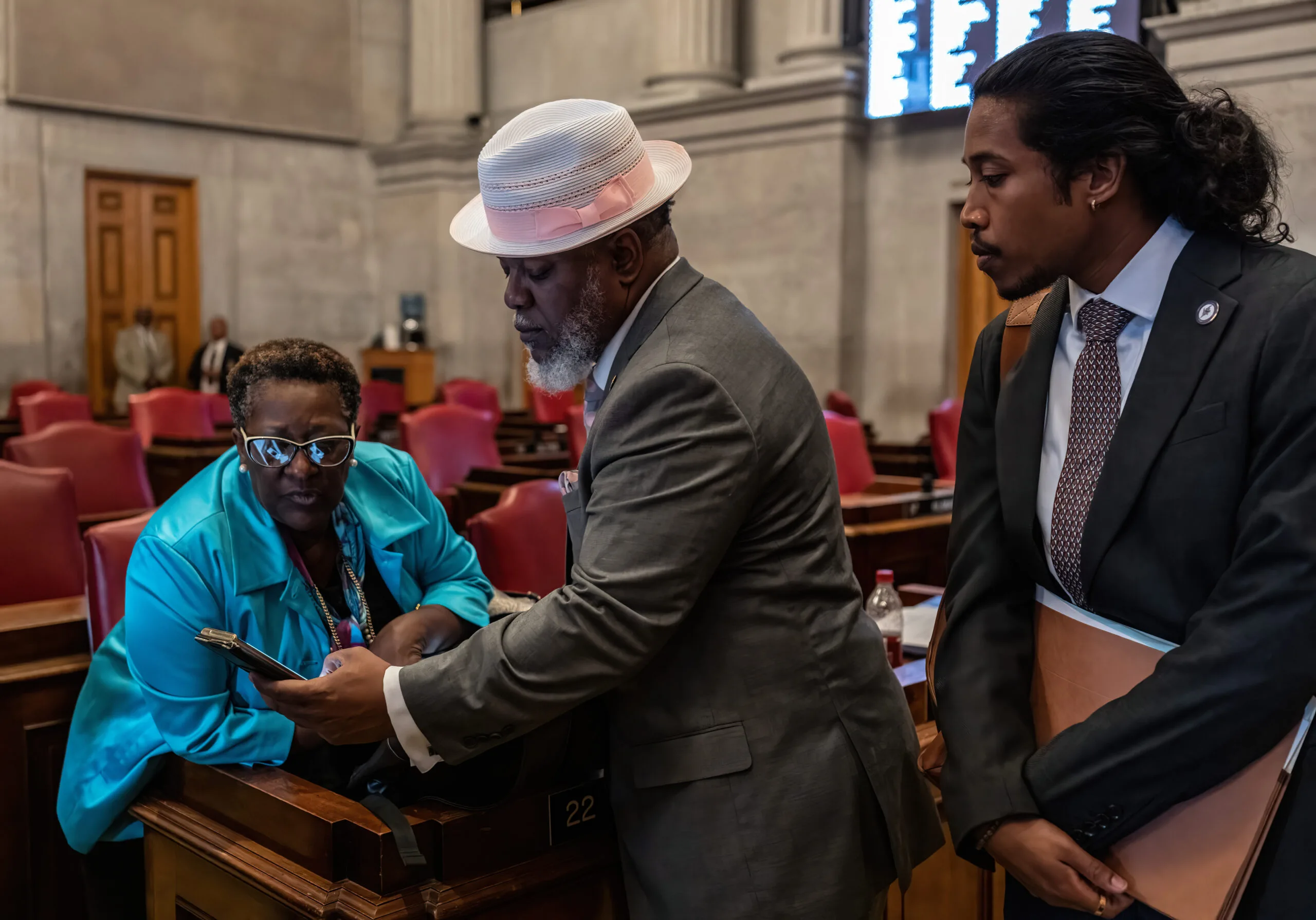 House Minority Leader Karen Camper, left, with Rep. Antonio Parkinson, D-Memphis, and Rep. Justin Jones, D-Nashville, review footage of an altercation at the conclusion of the August 2023 special legislative session. (Photo: John Partipilo)