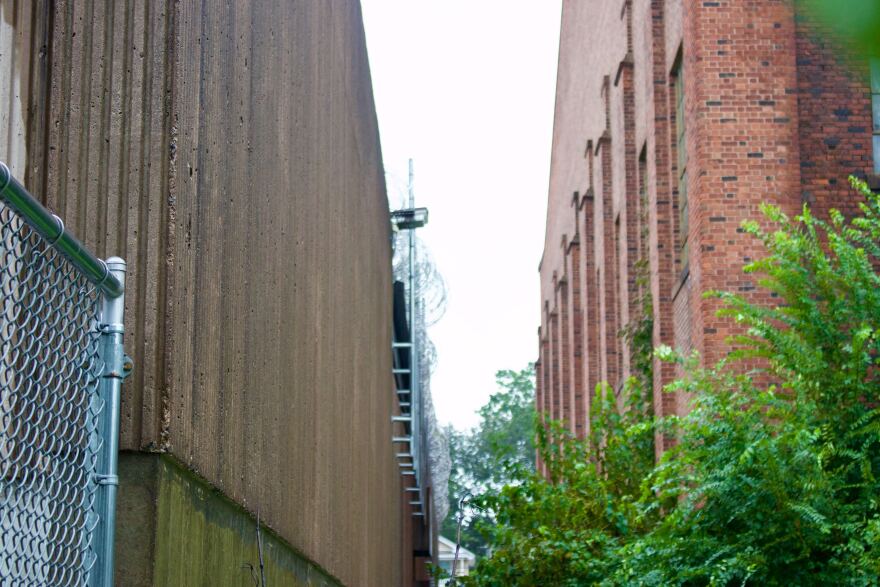 The New Haven Correctional Facility, left, and the Armory, right, are located within feet of one another. Mayor Justin Elicker says this serves as a reminder of the work to be done to ensure the criminal justice system is fair for everyone.