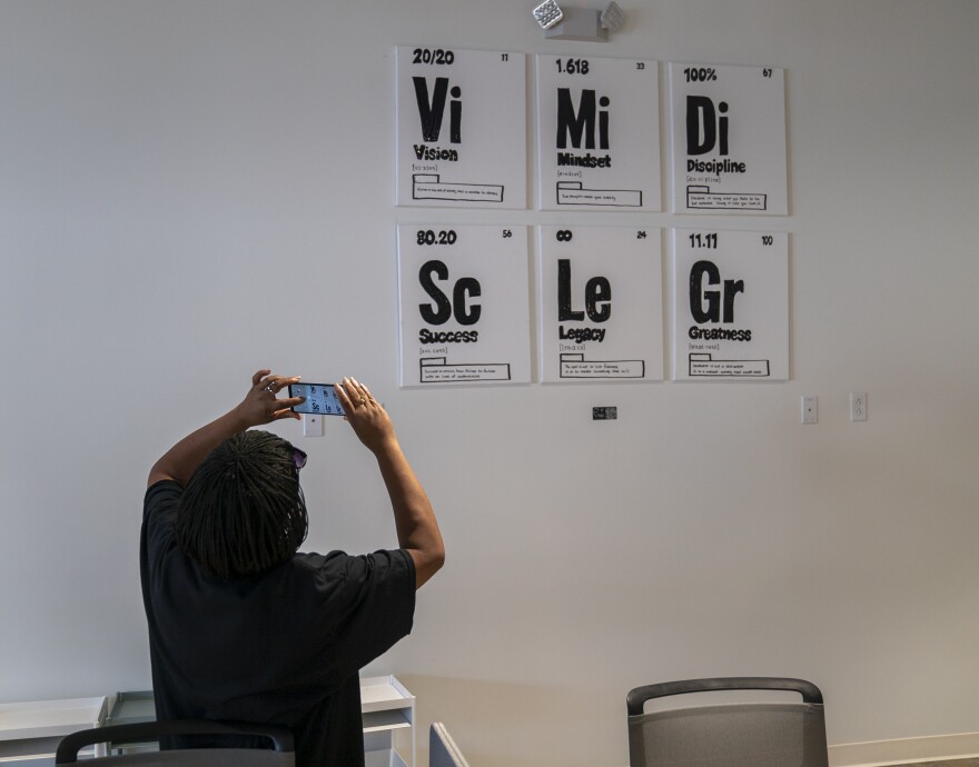 Loretta Price takes a photo inside the Northe County Innovation Center on September 14, 2023. The innovation center is part of the R&R Marketplace in Dellwood, MO, which opened the same day.