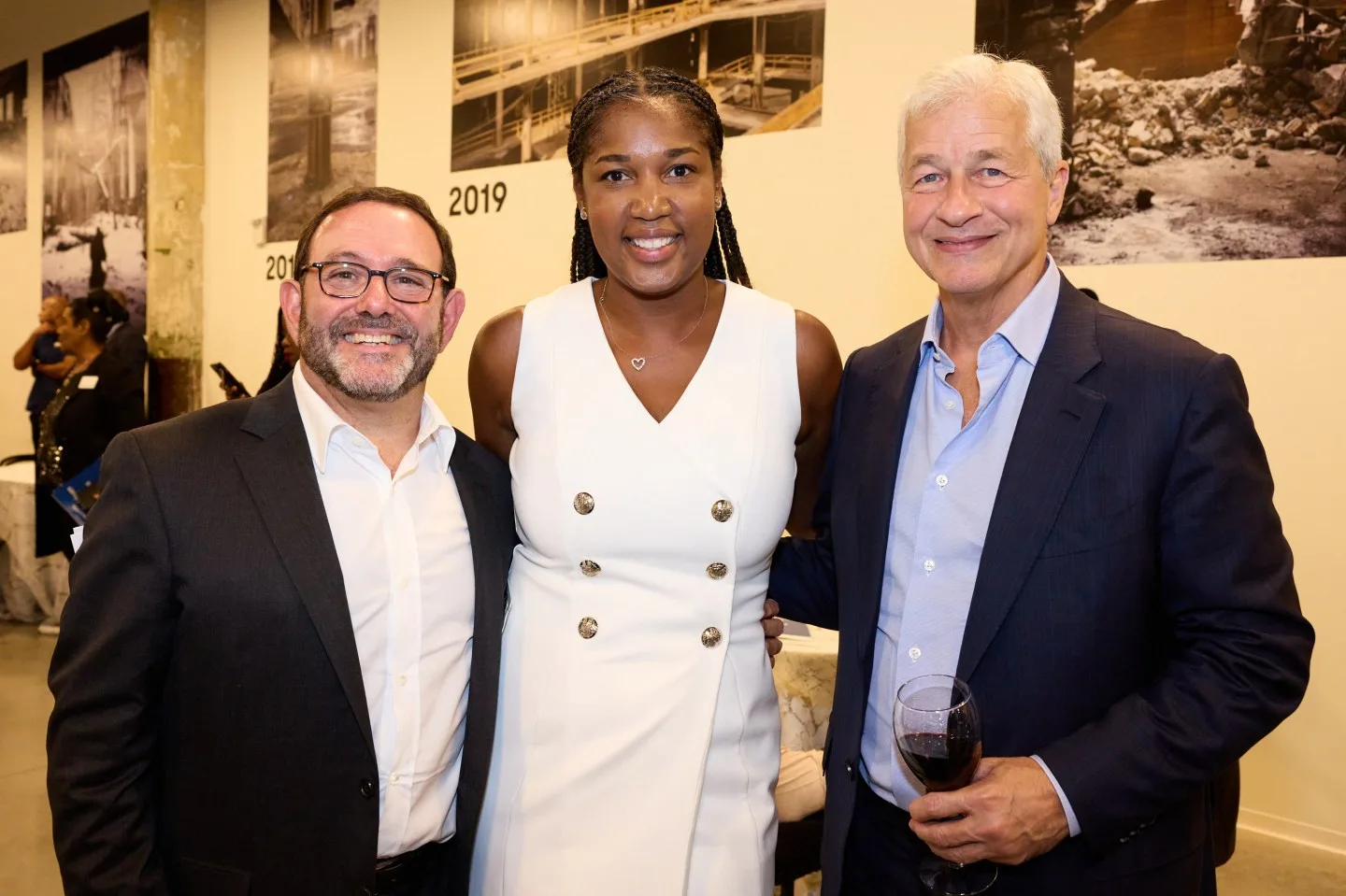 Peter Scher, Arhoda Simaj, and Jamie Dimon of JPMorgan Chase.