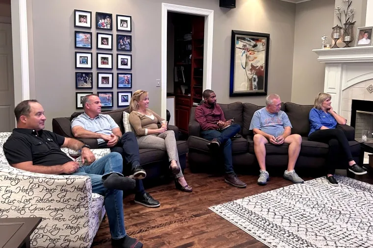 Image: A group of conservative voters in Wisconsin watch the Republican presidential primary debate.