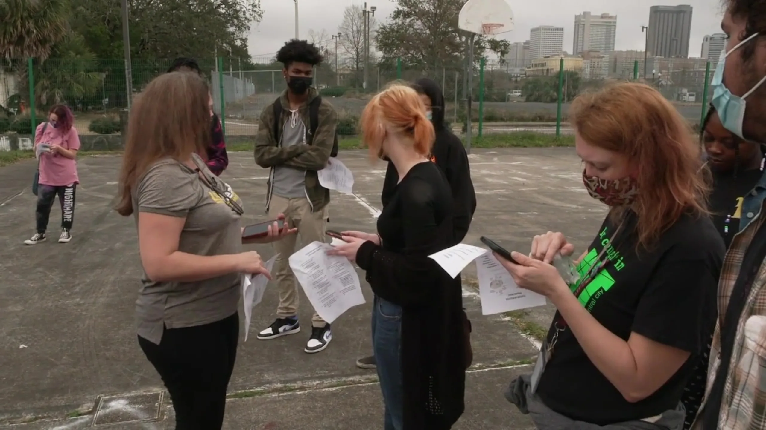 PHOTO: Dr. Adrien Katner of Louisiana State University prepares local science students on a field trip to measure air pollution in a park beside the Claiborne Avenue Expressway.