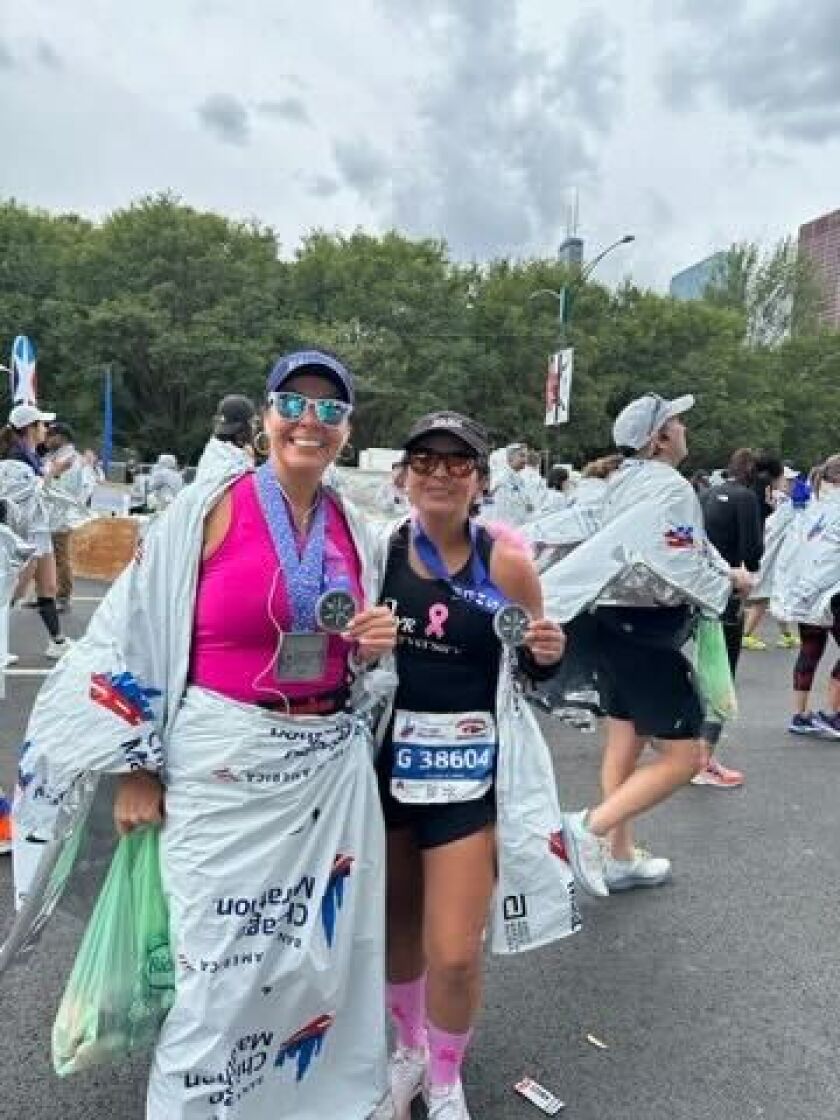 Erika Aleman (left) ran in the Chicago Marathon earlier this month, crossing the finish line with a time of three hours and 44 minutes — her personal best. Aleman, 44, has run 14 marathons, but this was her first since being in remission for breast cancer.