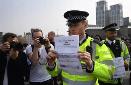 Police in London issue Extinction Rebellion protesters with Public Order Act warnings over their action to close Waterloo Bridge in 2019