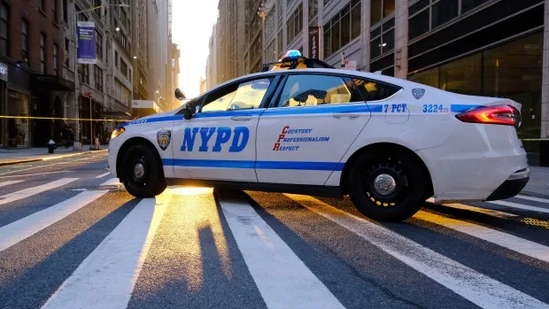 New York police vehicle with setting sun.