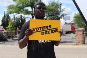 Voting rights activists and others gathering at the Midtown Center in Milwaukee on the first day of early voting in July, 2022. (Photo | Isiah Holmes)