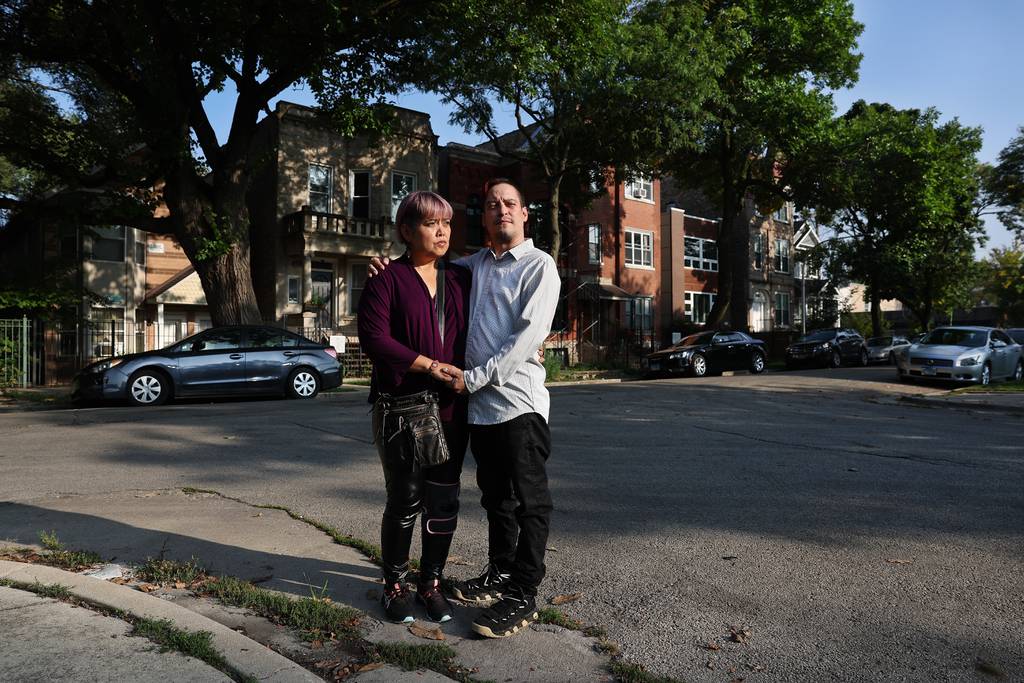 Eloisa Luistro-Rodriguez and Gabriel Rodriguez at the corner of Crystal and Rockwell streets in Chicago’s Humboldt Park neighborhood on Sept. 29, 2023. The couple was carjacked at this location in May, with Gabriel suffering a traumatic brain injury after being hit in the head with a gun.