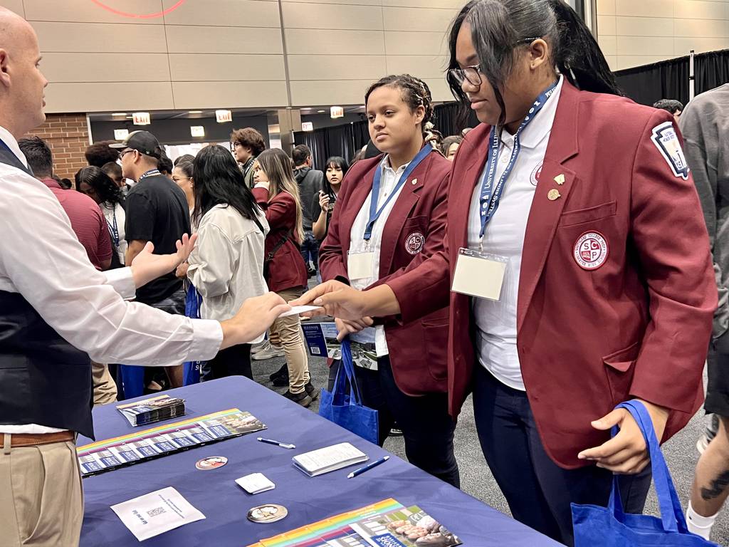 Students from Southland College Prep Charter High School in Richton Park attend a college fair last week during the University of Illinois Salute to Academic Achievement at the UIC Dorin Forum.