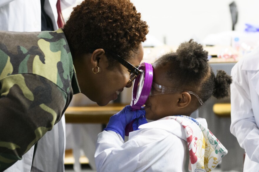 Teacher Cameil Jones Barrett shares a silly moment with student Caiya Nemons.