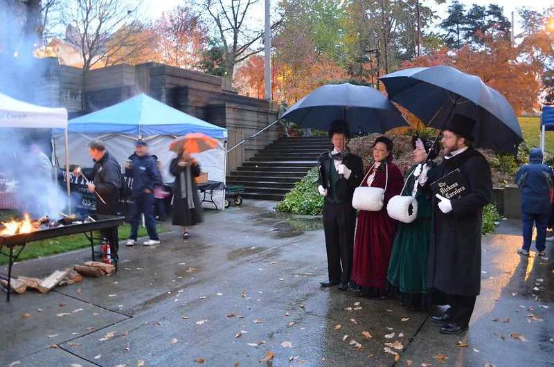 The Dickens Carolers, shown at Freeway Park.  In 2023 they will sing at Denny Park and City Hall Park.