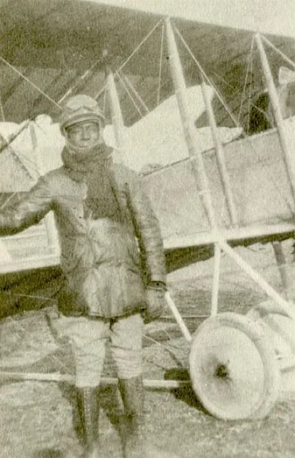 Eugene Bullard standing in front of a Caudron G.3 aeroplane, circa 1917.