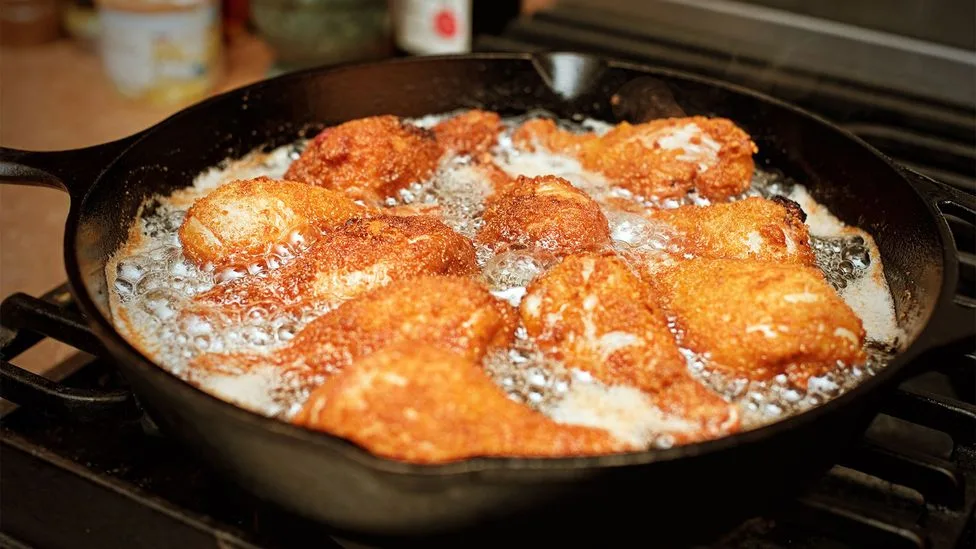 Maryland chicken is dredged in seasoned flour and fried in a cast iron pan (Credit: Stacey Newman)