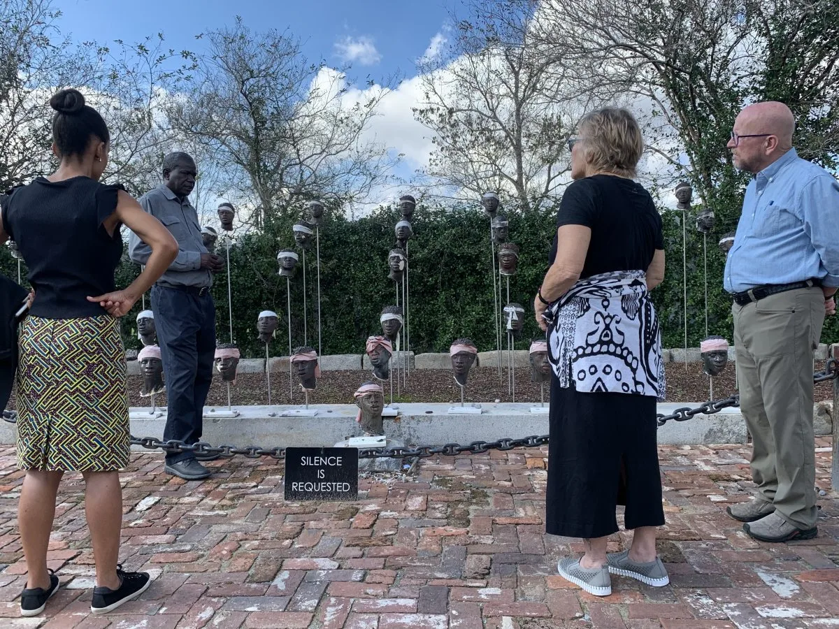 Two of the donors examine monument