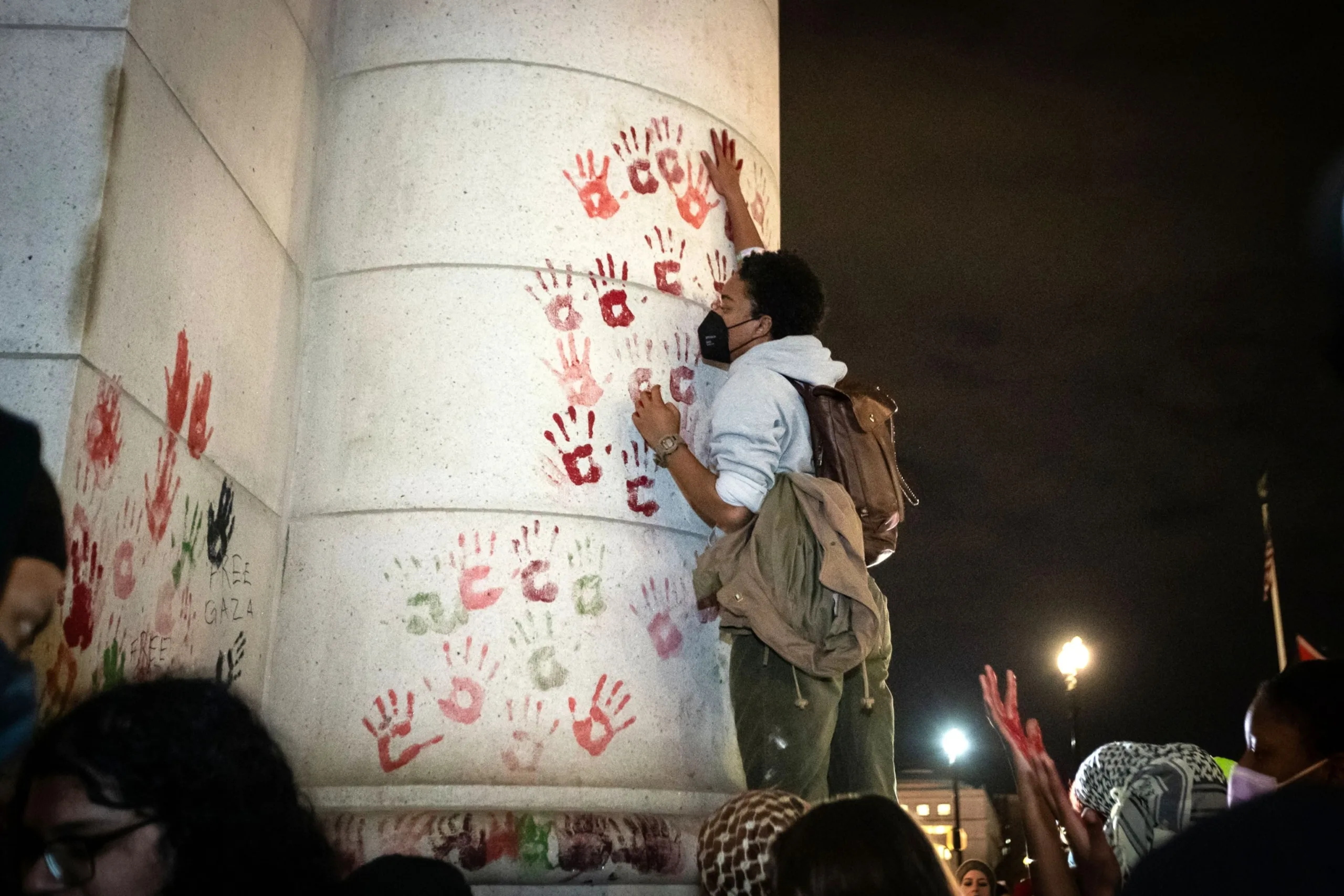 PHOTO: A demonstrator leaves a painted handprint on the wall of Union Station during a rally demanding a ceasefire for Palestine, on Nov. 17, 2023, in Washington, D.C.