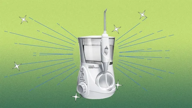 Waterpik's Aquarius model on a green background with stars