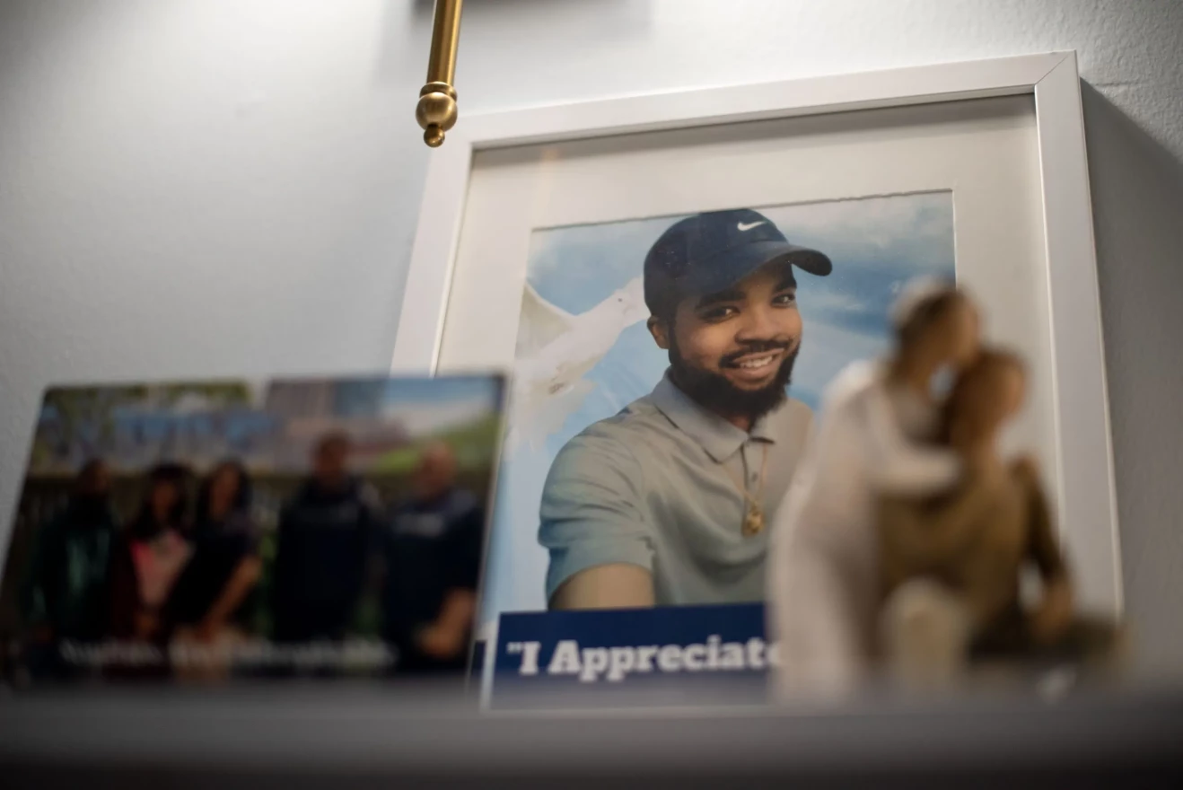 A portrait of Cassandra Carter’s son, Chase, sits on the mantle of her living room. 