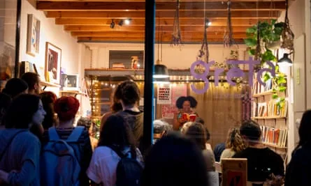 People attending a reading at Greta Livraria