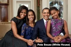 President Barack Obama, First Lady Michelle Obama, and their daughters, Sasha and Malia, sit for a family portrait in the Oval Office, Dec. 11, 2011. (Official White House Photo by Pete Souza)