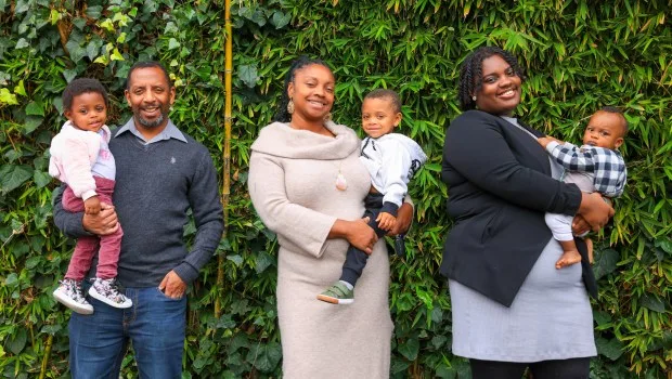 Hope Williams-Burt, center, along with her husband, Ken Burt, second from left, and their children from left is Mykylah, 1, Kingston, 2, her daughter Myrai Mills-Burt, 20, and her 9-month-old son, Jeremyah at UCSF Benioff Claremont clinic in Oakland, Calif., on Friday, Jan. 26, 2024. Williams is a client at BLOOM: Black Baby Equity Clinic which provides care for Black families with babies and toddlers from a team of Black health care workers at the UCSF Benioff Claremont clinic. (Ray Chavez/Bay Area News Group)