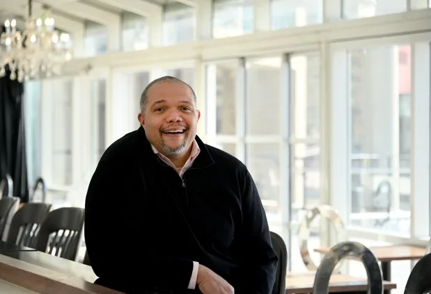 P. David Bramble, managing partner and co-founder of Baltimore-based MCB Real Estate. Bramble is leading MCB's project to redevelop Harborplace, which it owns, into a mixed-use development. He is in Crust by Mack, a new business in the Pratt Street pavilion at Harborplace. (Kim Hairston/Staff photo)