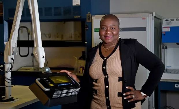 Kerri-Ann Lawrence is the first woman of color to be Lab Director of Forensic Services for the Baltimore County Police Department. She is standing in the county's fingerprint lab. (Barbara Haddock Taylor/staff photo)