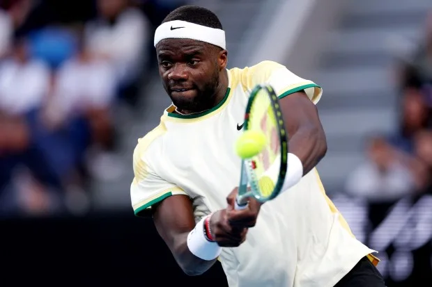 Frances Tiafoe of the United States plays a backhand in their round two singles match against Tomas Machac of the Czech Republic during the 2024 Australian Open at Melbourne Park on Jan. 17, 2024 in Melbourne, Australia. (Photo by Phil Walter/Getty Images)