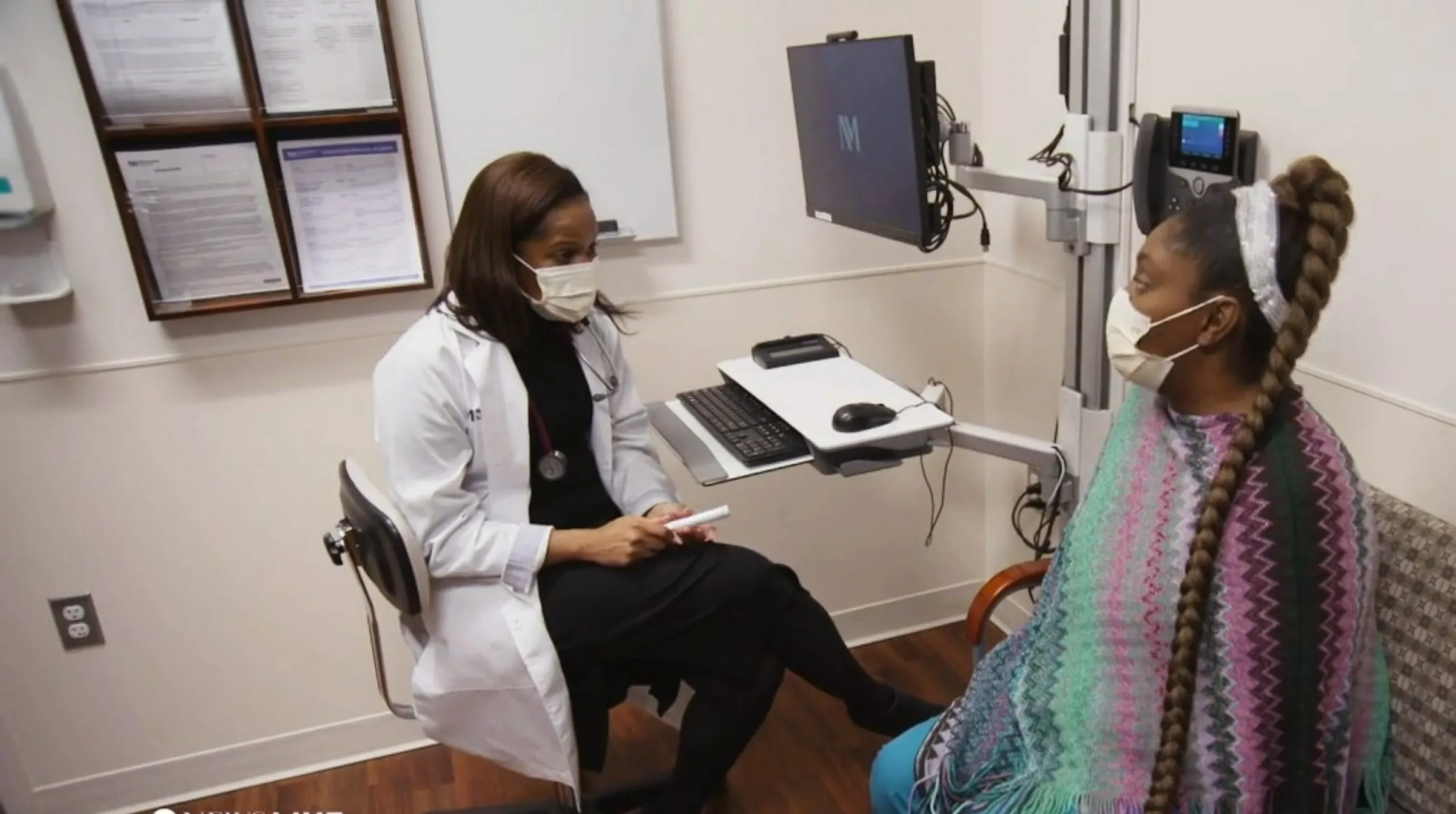 PHOTO: Dr. Veronica Johnson speaks with a patient.