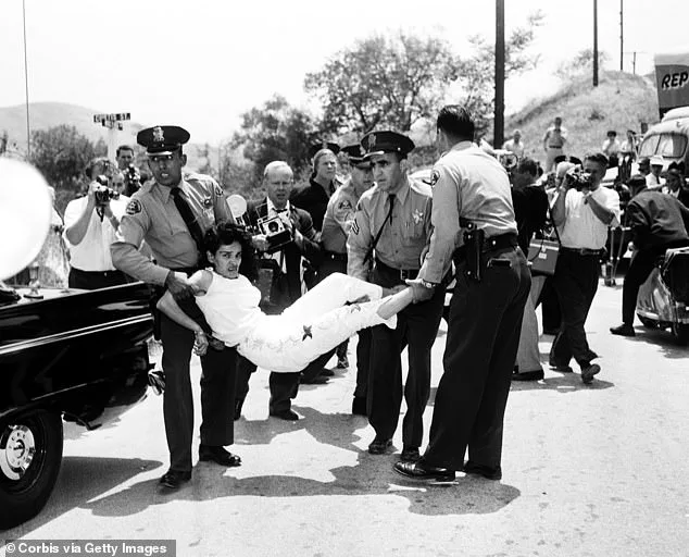 Los Angeles Sheriff's deputies pictured forcefully removing Chavez Ravine resident Aurora Vargas from her home in 1959, the same year the stadium was built